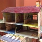 Vintage doll house and dolls.