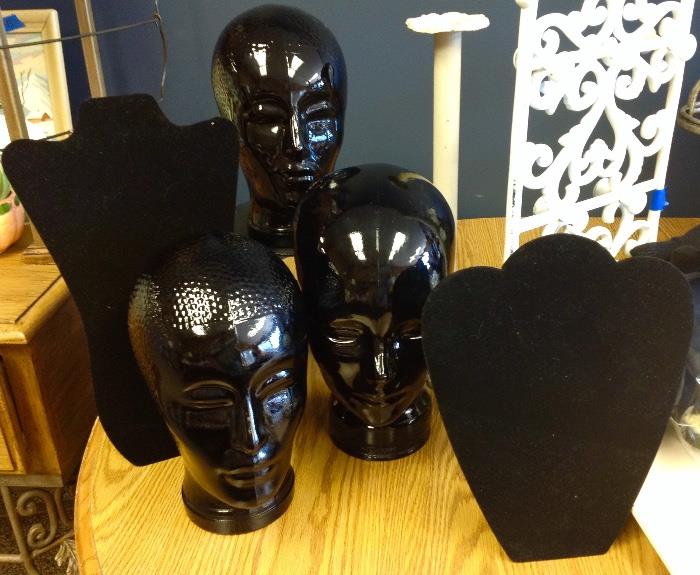 Several black glass heads. Make great hat display pieces.