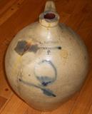 One of several stoneware jugs and crocks.
