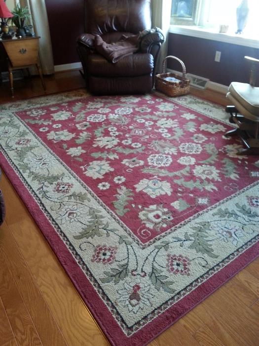 Acrylic rug approximately 8'x10'.  Leather recliner NOT for sale.