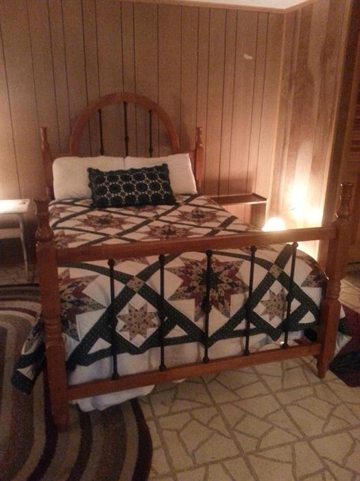 Double bed made of pine and wrought iron.  Bed and rails.