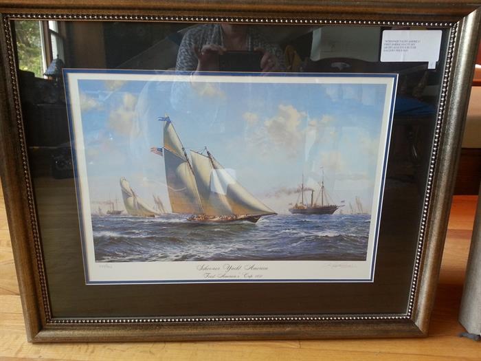 One of a pair of sailing ship prints framed in a decorative frame
