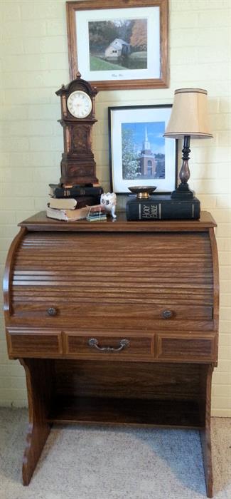 Small oak roll top desk, Bonsack Baptist Church Print, and Mabry Mill print framed.  Battery operated clock.Decorator table lamp. 