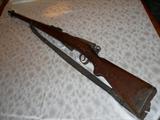 Model 1911 Schmidt-Rubin light rifle. Swiss manufactured no later than 1935. Chambered for the 7.5mm Swiss cartridge.  Straight-pull, bolt action rifle with 5 round clip.