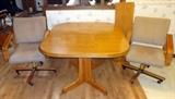 Kitchen Table With Leaf and 2 Rolling Chairs      http://bid.auctionbymayo.com/view-auctions/catalog/id/7395/lot/929392/?url=%2Fview-auctions%2Fcatalog%2Fid%2F7395%2F 