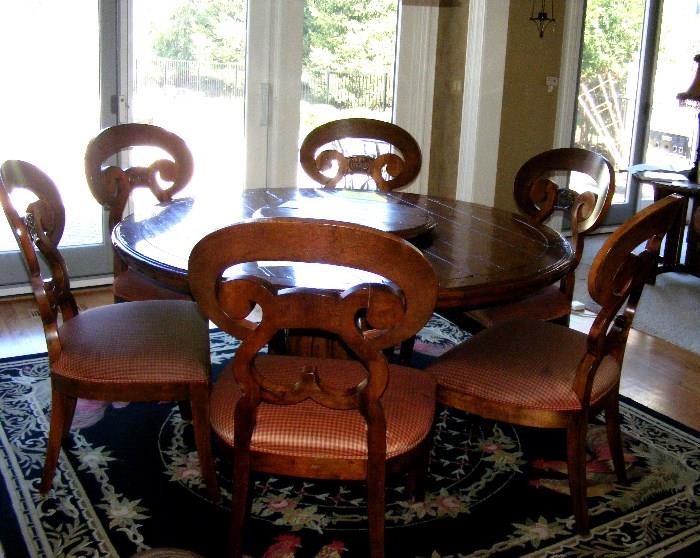 DR or Kitchen Round Table and 6 chairs. Lazy susan is removeable. Not attached to table