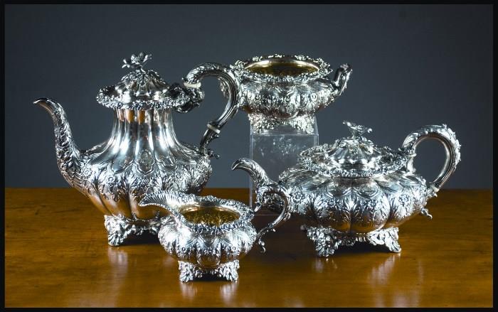lot #723 - KING GEORGE III STERLING SILVER REPOUSSE COFFEE AND TEA SET
