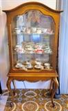 Curio Cabinet with cups & saucers