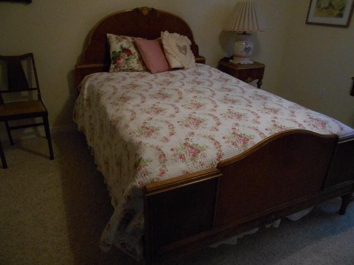 Antique bed with coverlet