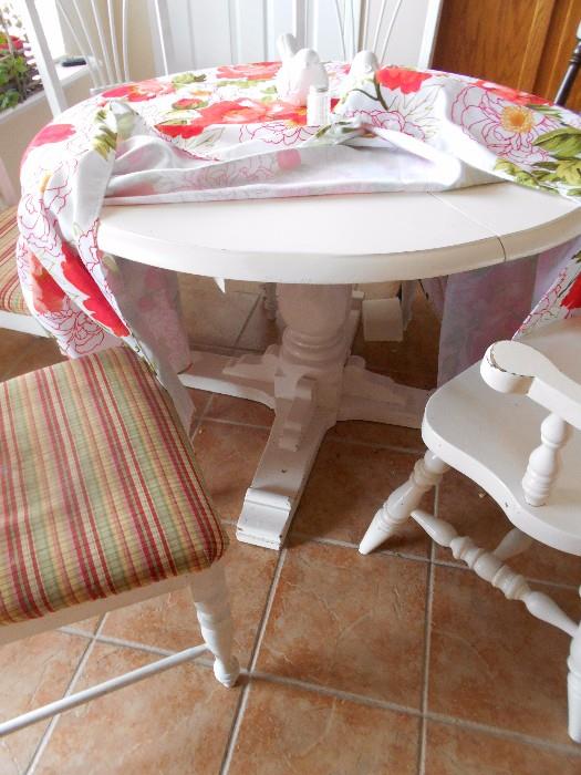 Round white wood table with 4 chairs