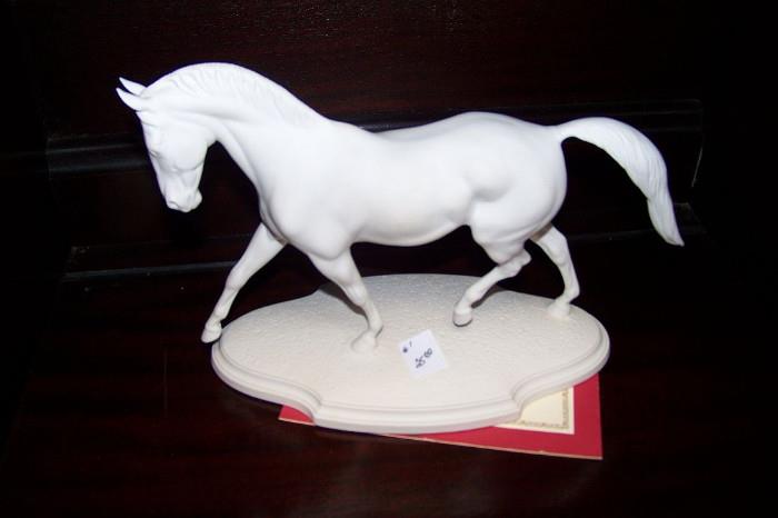One of three beautiful porcelain horses