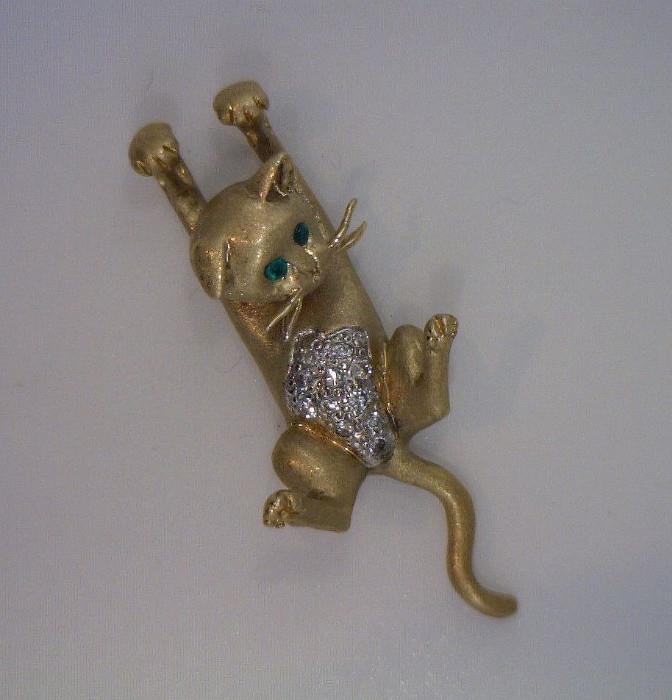 This little cat is signed - as emerald eyes, diamond belly, and hangs on a 14K adjustable chain