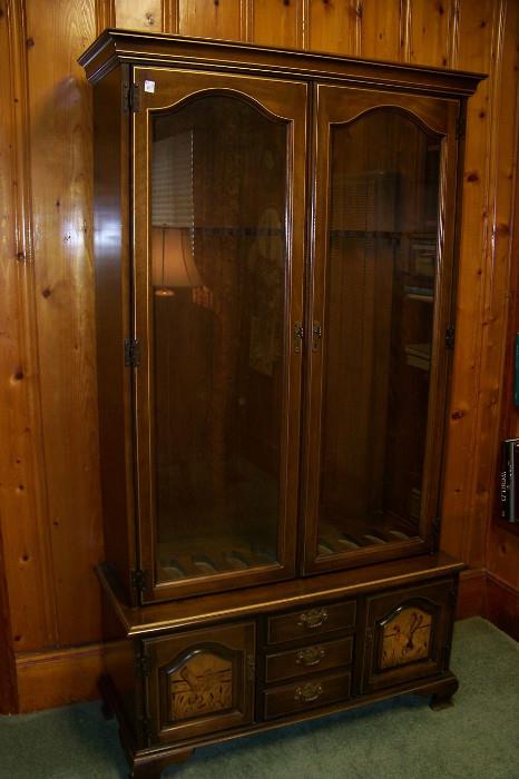Gun cabinet - could be adapted with shelving to create a display cabinet for glassware, dolls, etc.