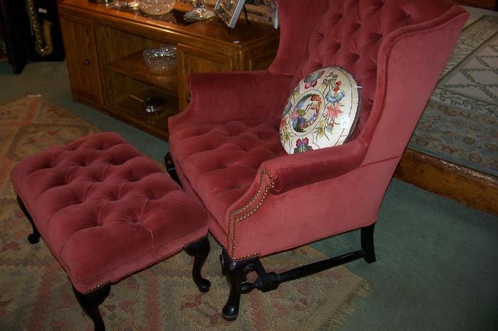 This is one of a pair of very pretty wing chairs with matching ottomans.  