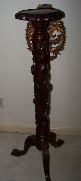 One of a pair of solid wood, carved fern stands