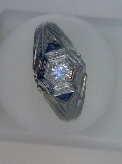18 white gold dinner ring, .50 ct center diamond, .20 side stones, circa 1920-1930