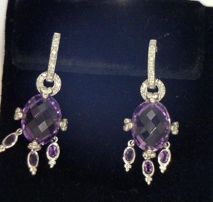 A pair of beautiful 14K white gold earrings - (4.3 amethyst and .33 ct. diamonds -