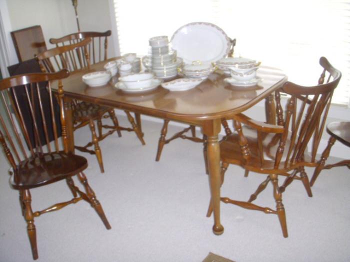 Cherry dining table with leaf, 2 arm chairs & 4 side chairs.