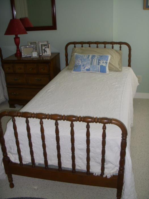 One of a pair of "Jenny Lind" twin beds, along with a bedside chest