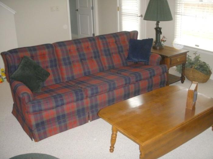 Nice looking plaid sofa.  Drop-leaf coffee table (one leaf shown up, one shown down)