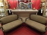 Two Louis XV style loveseats in black and gold, sold separately