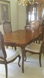 Drexel Heritage dining room table with 4 chairs & 2 leaves. Hutch with light and beveled glass is also Drexel Heritage. 