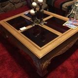 Large glass and wood coffee table.