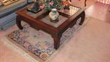 Hallmark Mandarin Style Wood & Glass Coffee Table with beveled Glass Inserts.  (coffee table is matching to end table and sofa table which are pictured elsewhere in this collection). Also pictured is an oriental style Wool area rug.