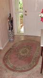 Oriental Style Oval Area Rug with floral pattern;  Also pictured Oriental Style Umbrella Stand