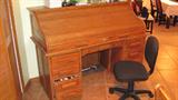 Oak Roll Top Desk with 3 and 3 drawer configuration, and post office style drawers & letter bins.  Also pictured is office chair on casters