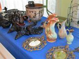 Some of the vintage and very collectible pottery available in this sale..pair of matching vintage McCoy Ewers, Vintage Haeger Ewers; Also shown is a very old Collectible Greek Relief Pot; Also pictured is a collection of vintage unique Black Wicker items; Also pictured is a vintage set of Black Cat Bookends. Other items shown are also available