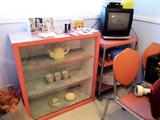 Vintage Retro 1950's Kitchen Furniture: Metal and Glass Display Cabinet w/ 3 shelves storage / display...pink finish; Matching Metal Roller Cart on wheels w/2 shelves storage; Matching Dinette Set...Metal Table with Disappearing Sliding leaves, 4 matching metal chairs with pink padded seats and backs