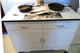 Vintage Hoosier style cabinet with flour bin, drawer and door storage; Vintage Cast iron skillets shown are also available...one is a Griswold and the other is a Wagner