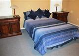 Plantation Style Bedroom Set - includes Double Size Bed with Mattress, Boxsprings and frame, 2 Matching Night Stands with elegant Rope Twist Accents and Mahogany Finish, with drawer and double door storage; Also Matching but pictured elsewhere in this collection is a  Triple Dresser with Mirror and twelve drawers; Pair of matching accent table lamps