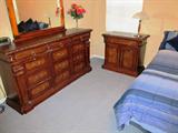 Plantation Style Bedroom Set - includes Double Size Bed with Mattress, Boxsprings and frame, 2 Matching Night Stands with elegant Rope Twist Accents and Mahogany Finish, with drawer and double door storage; Matching Triple Dresser with Mirror and twelve drawers; Pair of matching accent table lamps