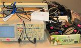 BK Precision Dual Trace Oscilloscope Model 2120.  Also pictured are some of the miscellaneous electronics and office accessories, and some of the  power adapters which are available