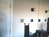 Pictured is the other side of the privacy temporary wall that must be moved to get the spa our of the garage.  Temporary wall is not load bearing and does not extend from floor to ceiling.