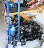 2 ea. US General light weight 3000 lb capacity floor jacks; Also pictured are some of the floor creepers available in this sale.