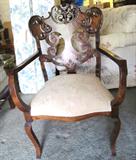 Vintage Continental Style Accent Occasional Arm Chair with Nicely Carved Accented back, cabriolet legs, mahogany finish, and white upholstery
