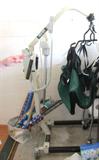 Electric Hoyer Medical Lift With Sling...powerful and portable...battery powered with built in charger. Unique Swan Neck design allows the lift to get close to obstacles. Compact...and folding for easy stowage. Able to provide a wide range of transfers. Very maneuverable...on wheels. Capacity 341 lbs safe working load