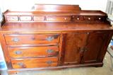 Vintage Colonial Style Buffet / Server by Sugar Hill...pine with a reddish oak style finish. Buffet has three large drawers, 7 smaller drawers and double door storage with brass pulls. Buffet / Server is part of matching set including a Hutch, Table and six chairs which are pictured elsewhere in this collection.