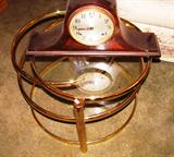 Brass and Glass tiered table...tiers swing out for additional table top space; Also pictured is a vintage Sessions Mantel Clock (no key available so we have been unable to check to see if it is fully functional)
