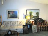 Lovely Queen Size Sleeper Sofa with Creme Colored Tufted Floral upholstery; Lovely Full Size Sleeper Loveseat with padded arms, Red & Beige Striped Upholstery; Also pictured are some of the artworks that are available in this sale. One is a vintage etching of St. Joan of Arc (likely circa late 1800's to early 1900's) Also shown is a Oriental Style Hand Painted Fan with Sand Hill Cranes and bamboo accents. Also shown are two Vintage Duck Lamps...one is missing shade.