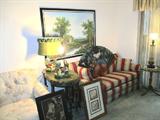 Lovely Full Size Sleeper Loveseat with padded arms, Red & Beige Striped Upholstery; Also pictured are some of the artworks that are available in this sale. One is a vintage painting of Joan of Arc (likely circa late 1800's to early 1900's) Also shown is a very nice Oriental Style Hand Painted Fan with Sand Hill Cranes and bamboo accents. Also shown are two Vintage Duck Lamps...one is missing shade, and two vintage end tables (not matching) one with nicely scalloped top and nicely turned legs and one with pedestal base. Also shown is a vintage etched glass accent table lamp with a metal dragon's head base.