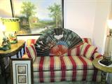 Lovely Full Size Sleeper Loveseat with padded arms, Red & Beige Striped Upholstery; Also shown is a very nice Oriental Style Hand Painted Fan with Sand Hill Cranes and bamboo accents. Also shown are two Vintage Duck Accent Table Lamps...one is missing shade. Also shown are two Vintage End Tables (not matching) that are available in this sale...one is a foyer sized table with scalloped edged top and nicely turned legs, The other is a pedestal style end table...both have antiqued finishes; Also shown is a Vintage Accent Etched Glass Table Lamp with a metal dragon's head base