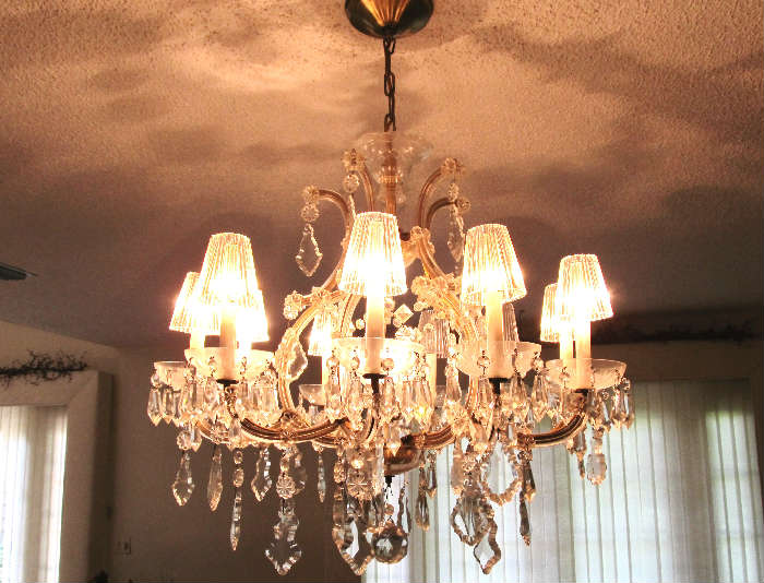Beautiful large Formal Crystal Chandelier with large and samll crystals, crystal shades, glass arms.  You will need to take it down and cap the wiring as part of your purchase of this chandelier...or for an additional fee we can take it down from where it is hung for you...but you will need to arrange for its handing at your home.