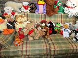 Living / Family Room Set includes Sofa with green and red plaid upholstery, matcing loveseat, matching arm chair; As shown is the sofa. The matching loveseat and arm chair are pictured elsewhere in this collection. Also shown are some of the collection of stuffed bears, and other animals