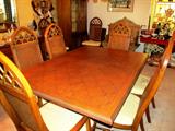 Continental Style Dining Set...includes large dining table with two extra leaves and table pads, 8 matching side chairs with white upholstered seats and woven cane backs with cross hatch style accented tops; matching lighted china cabinet with wood and glass double doors with brass batwing pulls, glass shelves and lower doors storage; matching server
