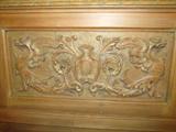Some of the carvings on an Antique Italian Style Church Bench...heavily carved, with ornate floral and figural carved accents. Bench also has storage. Very striking accent piece