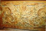 Some of the carvings on an Antique Italian Style Church Bench...heavily carved, with ornate floral and figural carved accents. Bench also has storage. Very striking accent piece